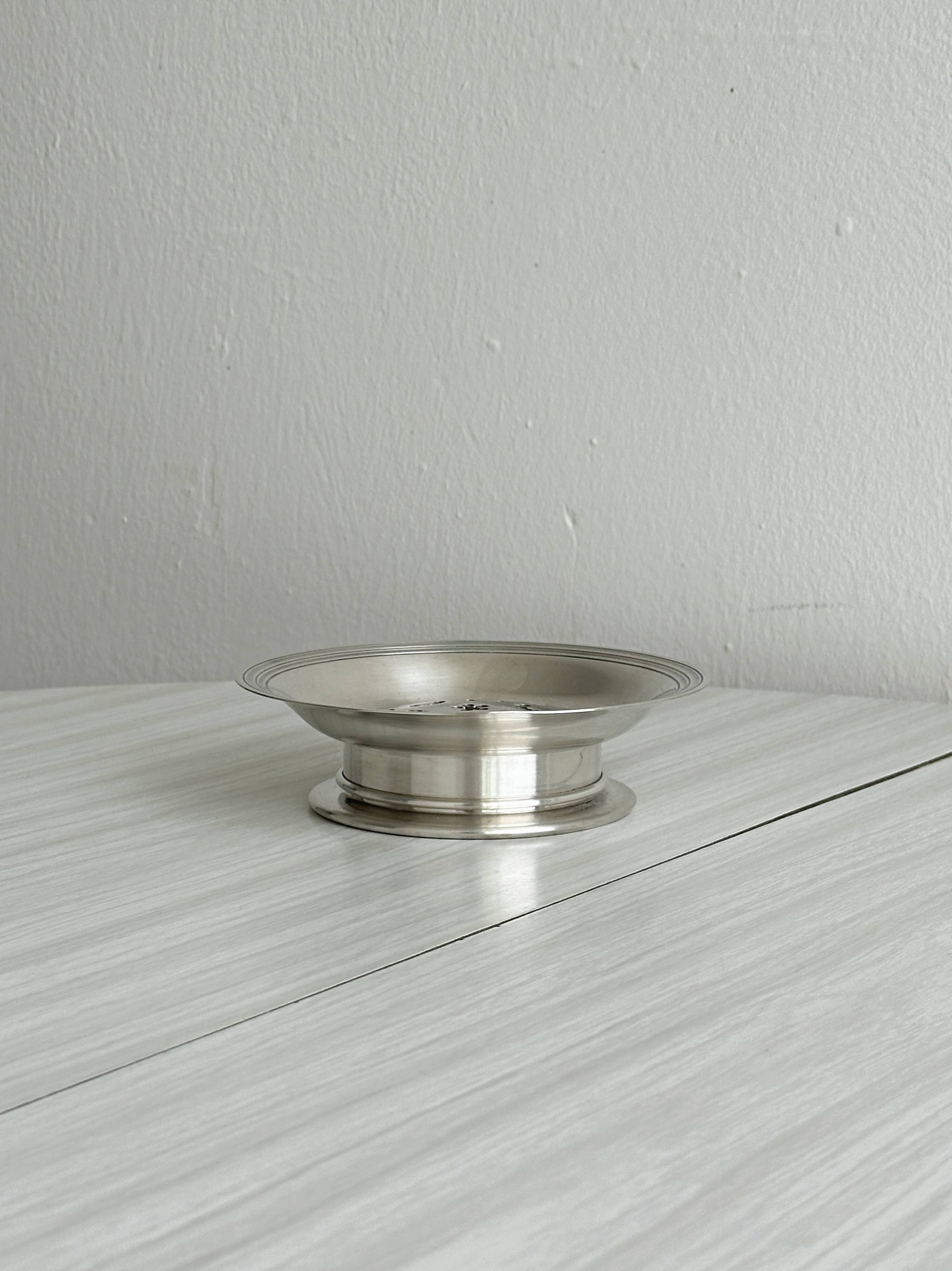 Antique shiny metal butter dish