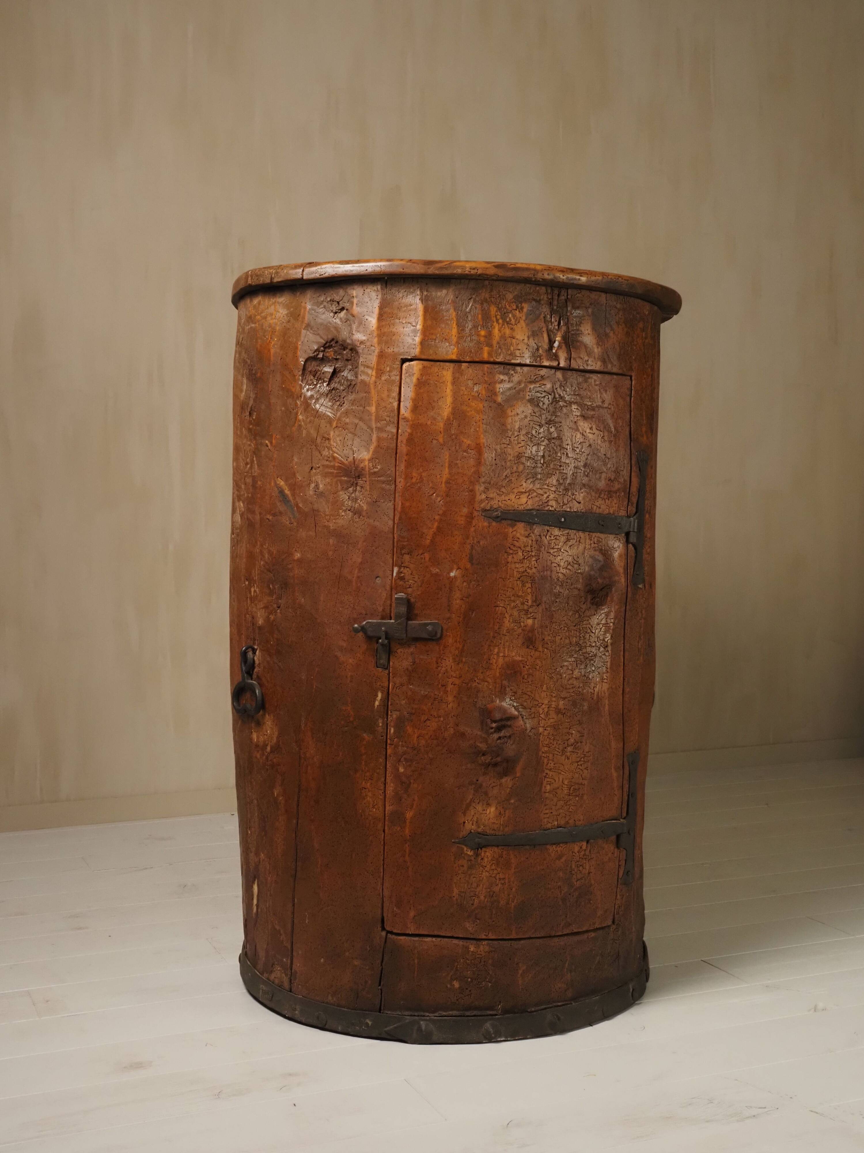 Primitive folk art cabinet made of an old tree trunk.