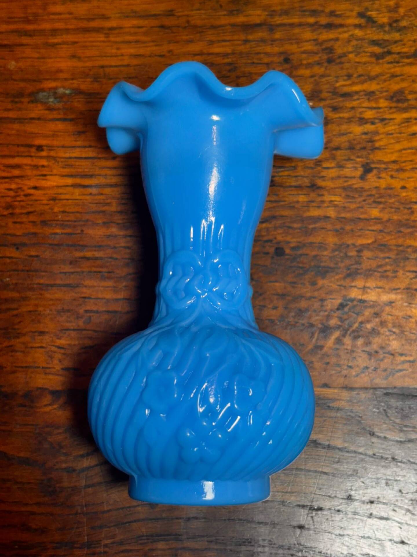Blue opaline vase, opaque glass, wavy neck/rim, relief decoration of a bow.