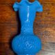 Blue opaline vase, opaque glass, wavy neck/rim, relief decoration of a bow.