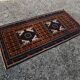 Vintage Persian Baluch rug, hand-knotted wool, 1970.
