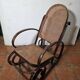 Curved wooden rocking chair with caning