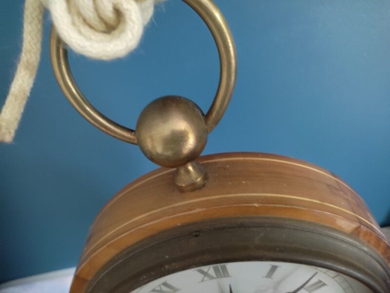 Patinated inlaid wooden clock shape watch pocket