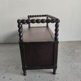 Natural wood chest forming a bench, ringed shoulders