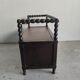 Natural wood chest forming a bench, ringed shoulders