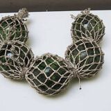 5 old glass fishing floats with rope net