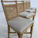 Suite de 4 chaises en rotin cannage et laiton