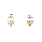 Pair of painted and gilded metal wall sconces adorned with crystals, Italy circa 1920.