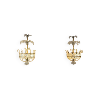 Pair of painted and gilded metal wall sconces adorned with crystals, Italy circa 1920.