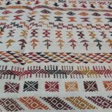 White carpet with multicolored Berber patterns