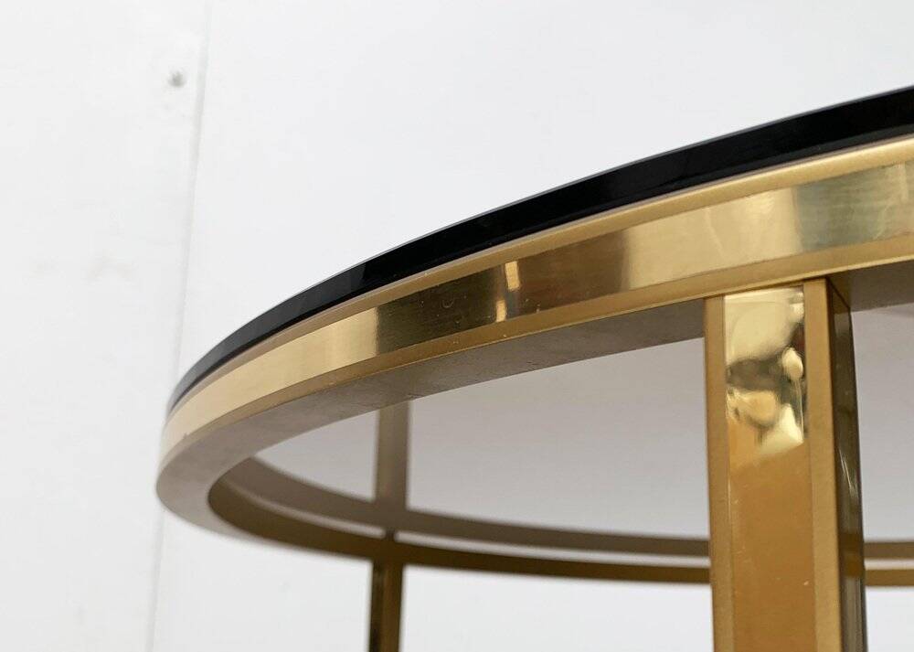 Mid-century Hollywood Regency style coffee table in brass and glass, made in Germany by Vereinigte Werkstätten, 1960s.