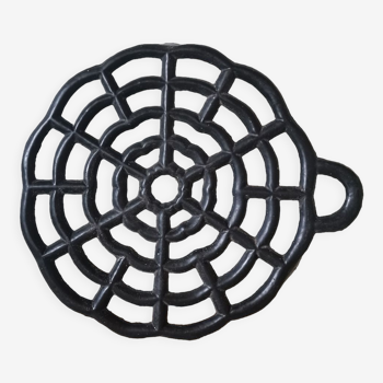 Black vintage cast iron trivet