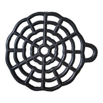 Black vintage cast iron trivet