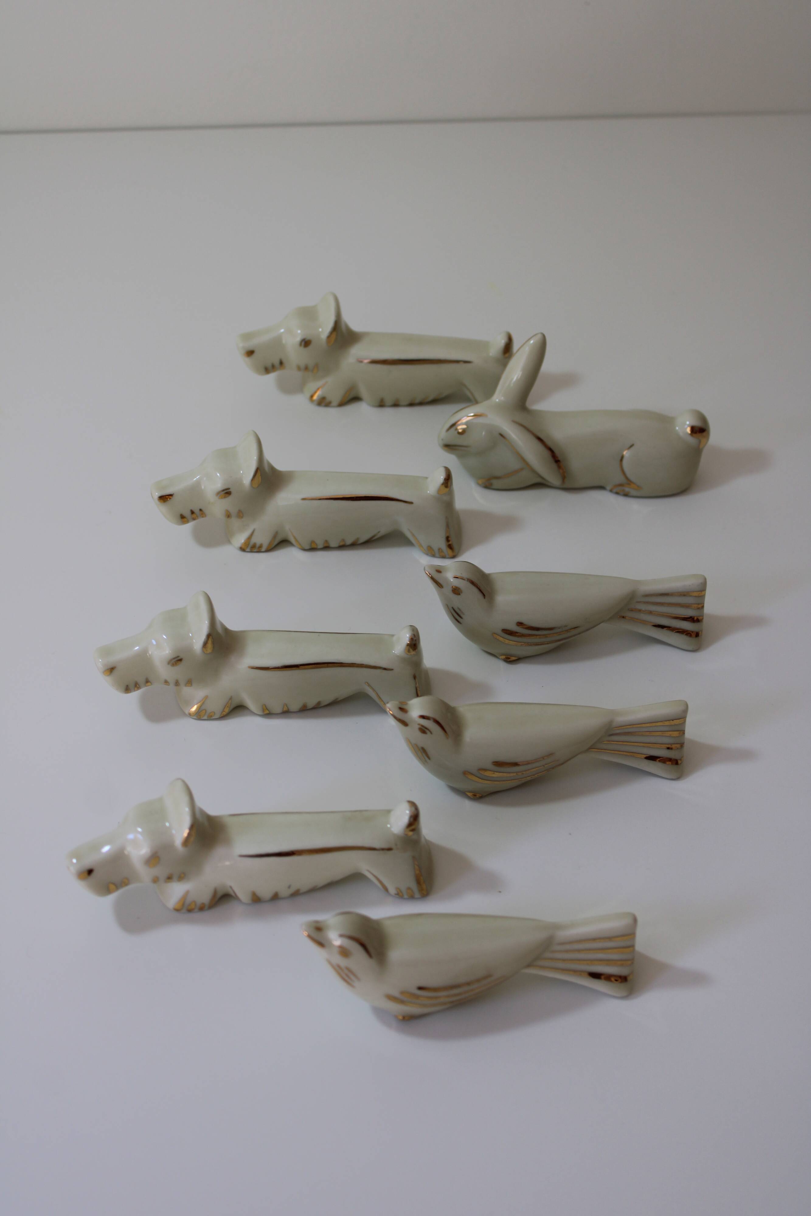 8 portes couteaux animaux porcelaine de Limoges vintage
