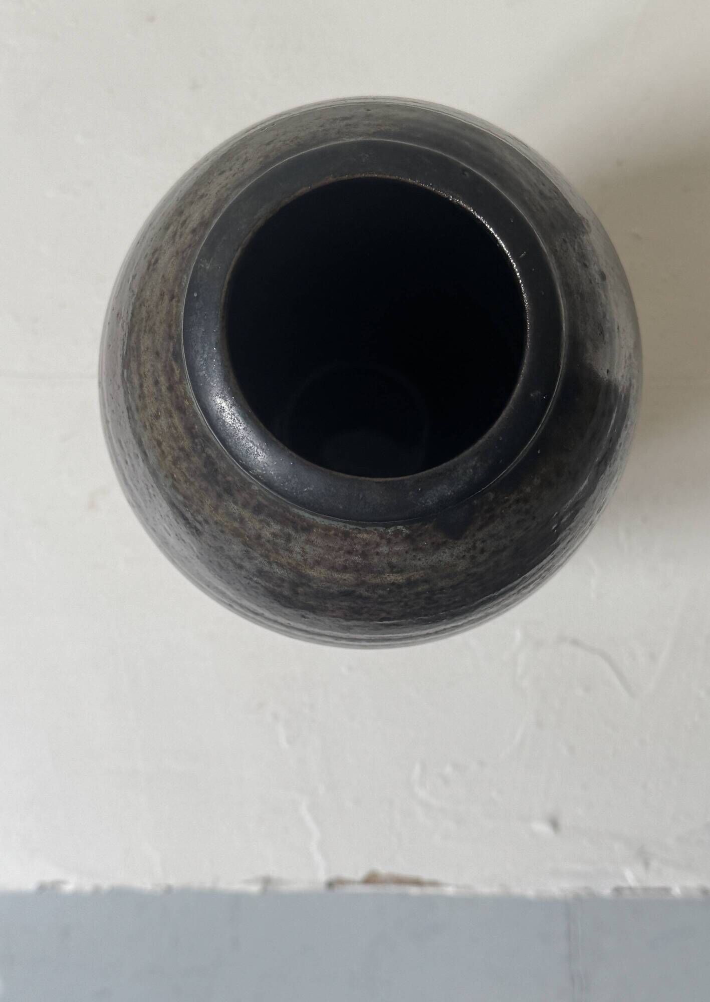 Brown-black glazed stoneware vase, signed underneath the base, circa 1950.