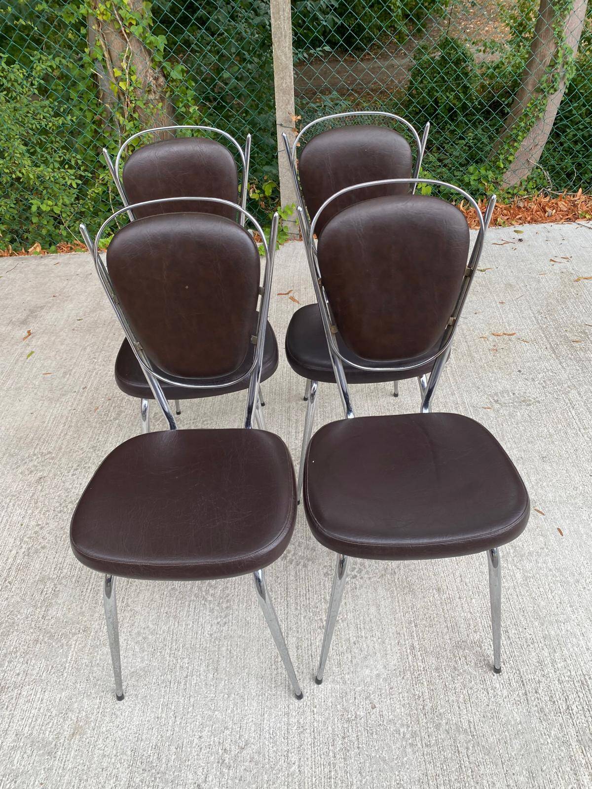 Set of 4 vintage chairs from the 60s/70s in brown faux leather with chrome compass legs.