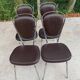 Set of 4 vintage chairs from the 60s/70s in brown faux leather with chrome compass legs.