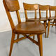 Set of 4 vintage solid oak chairs, 1960s design with sculpted backrest.