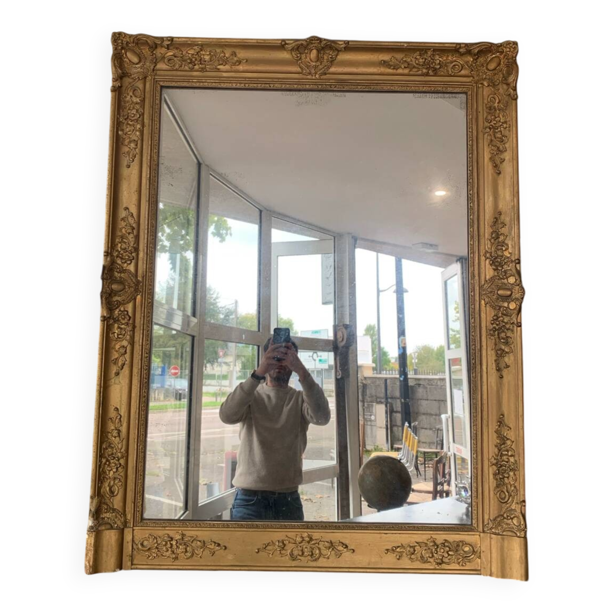 Old gilded mirror fireplace, 19th century restoration