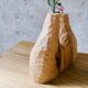 Hand-carved soliflore vase in solid lime wood.