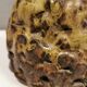Ceramic table lamp, in greenish/brownish glaze, almost in the shape of a volcano.