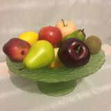 Glass cup and dummy fruit