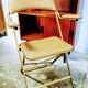 Chaise à bras dorée pliante