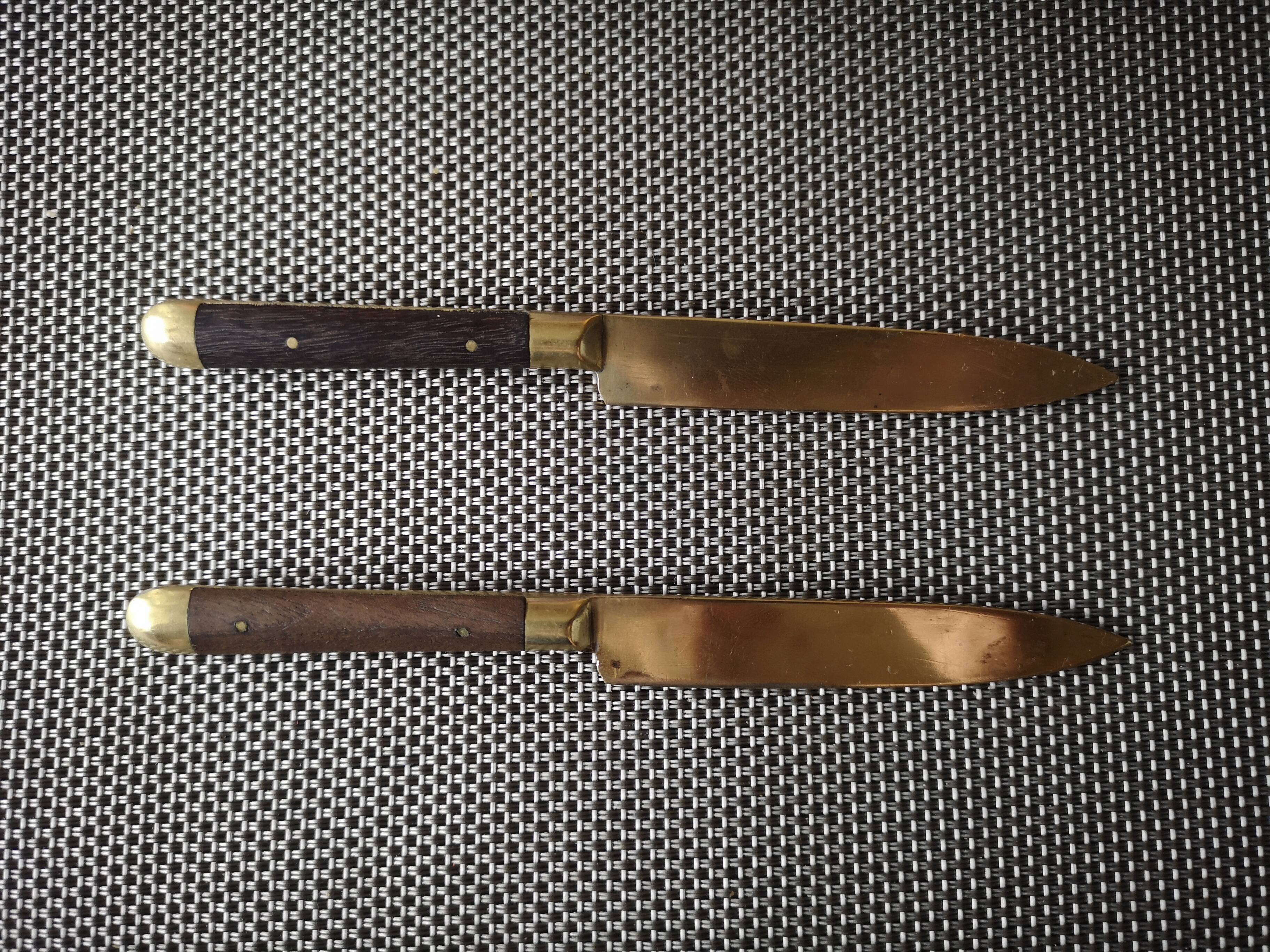 Pair of brass and wood knives