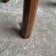 Dark brown solid oak brutalist stool with sculptural backrest, handcrafted mid-century rustic primitive