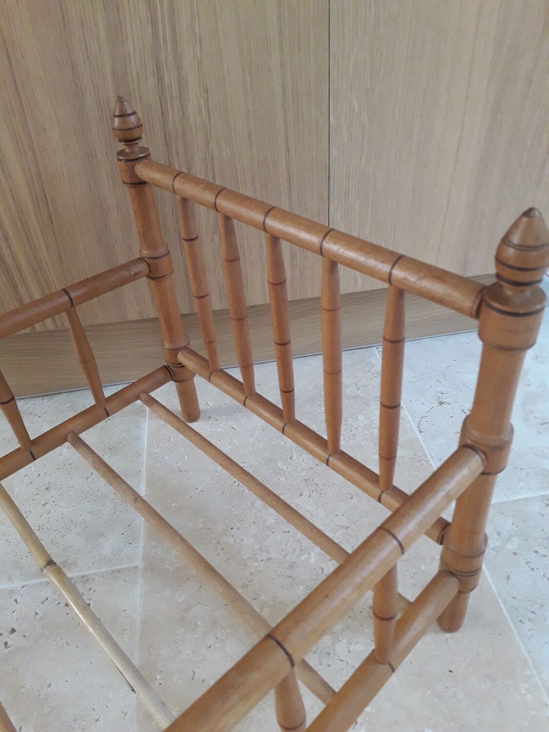 Old wooden doll's bed