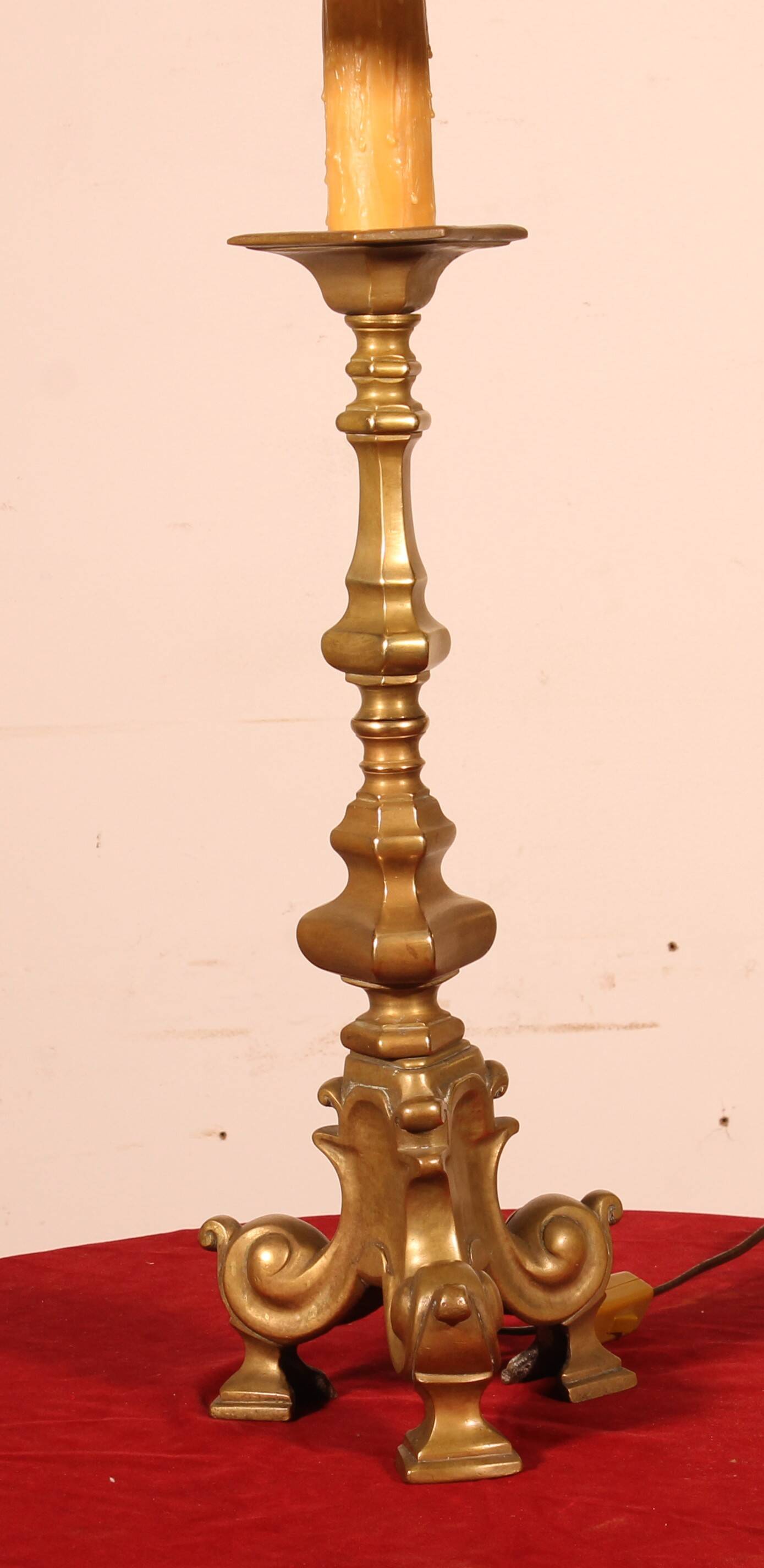 bronze candlestick from the 18th century converted into a lamp with its shade