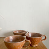 Three antique stoneware cups