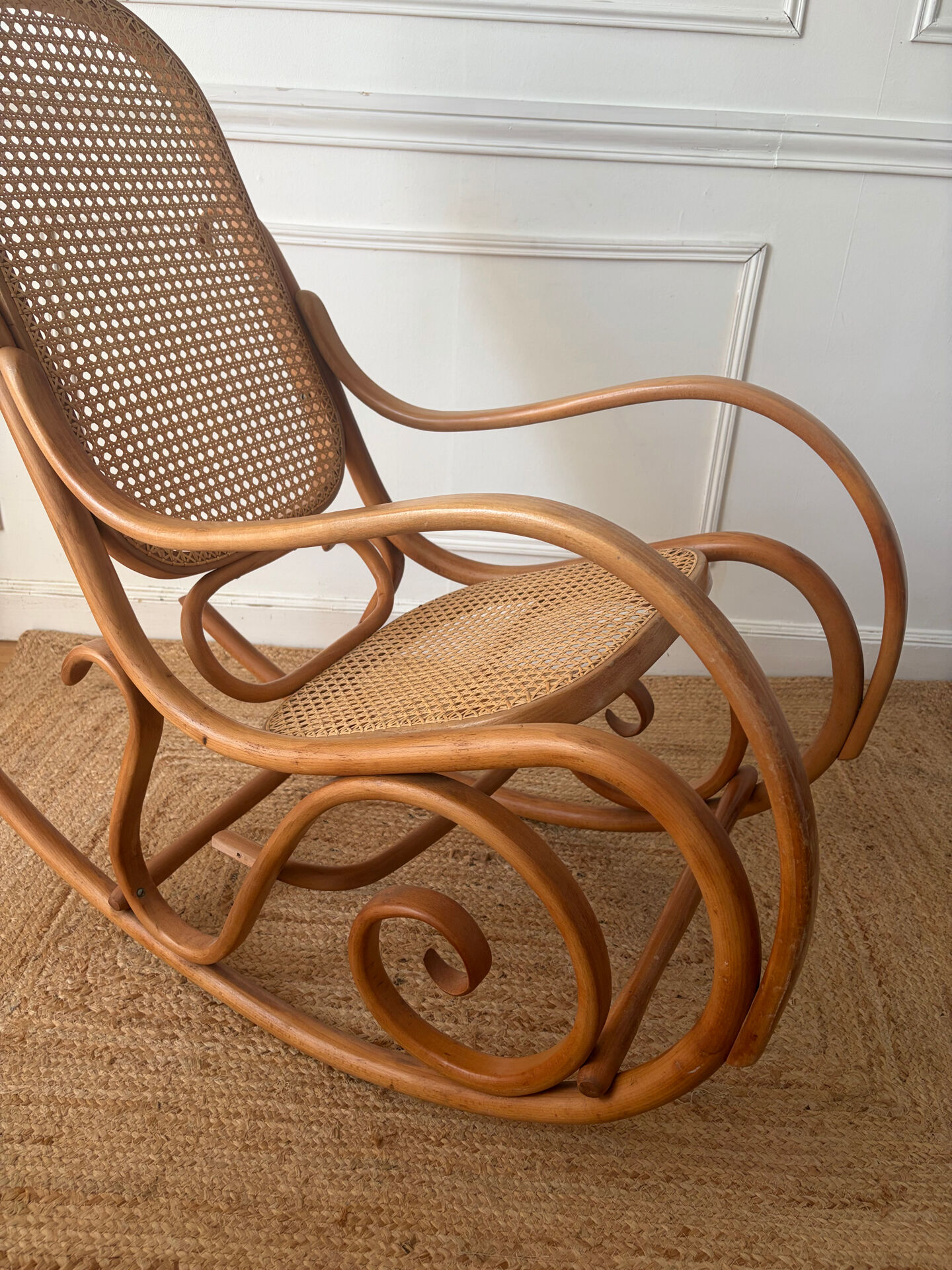 Curved wooden rocking chair