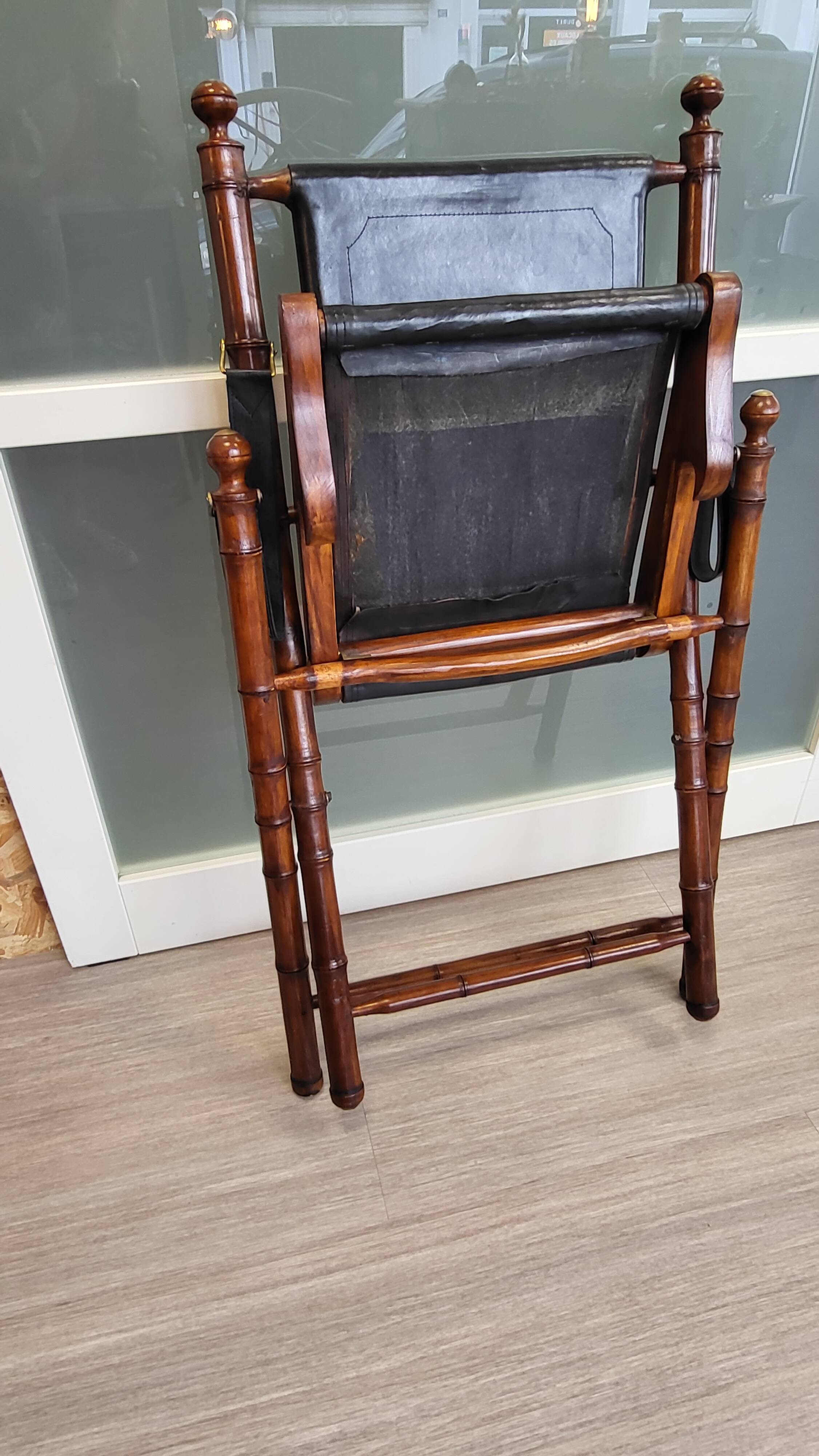 Colonial style folding leather and teak armchair