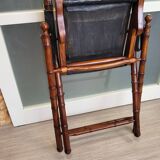 Colonial style folding leather and teak armchair