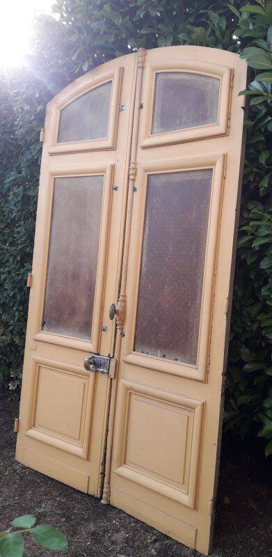 19th century double arched entrance door in oak with grilles and old glass