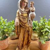Statue of the Virgin holding the Child Jesus in polychrome terracotta.