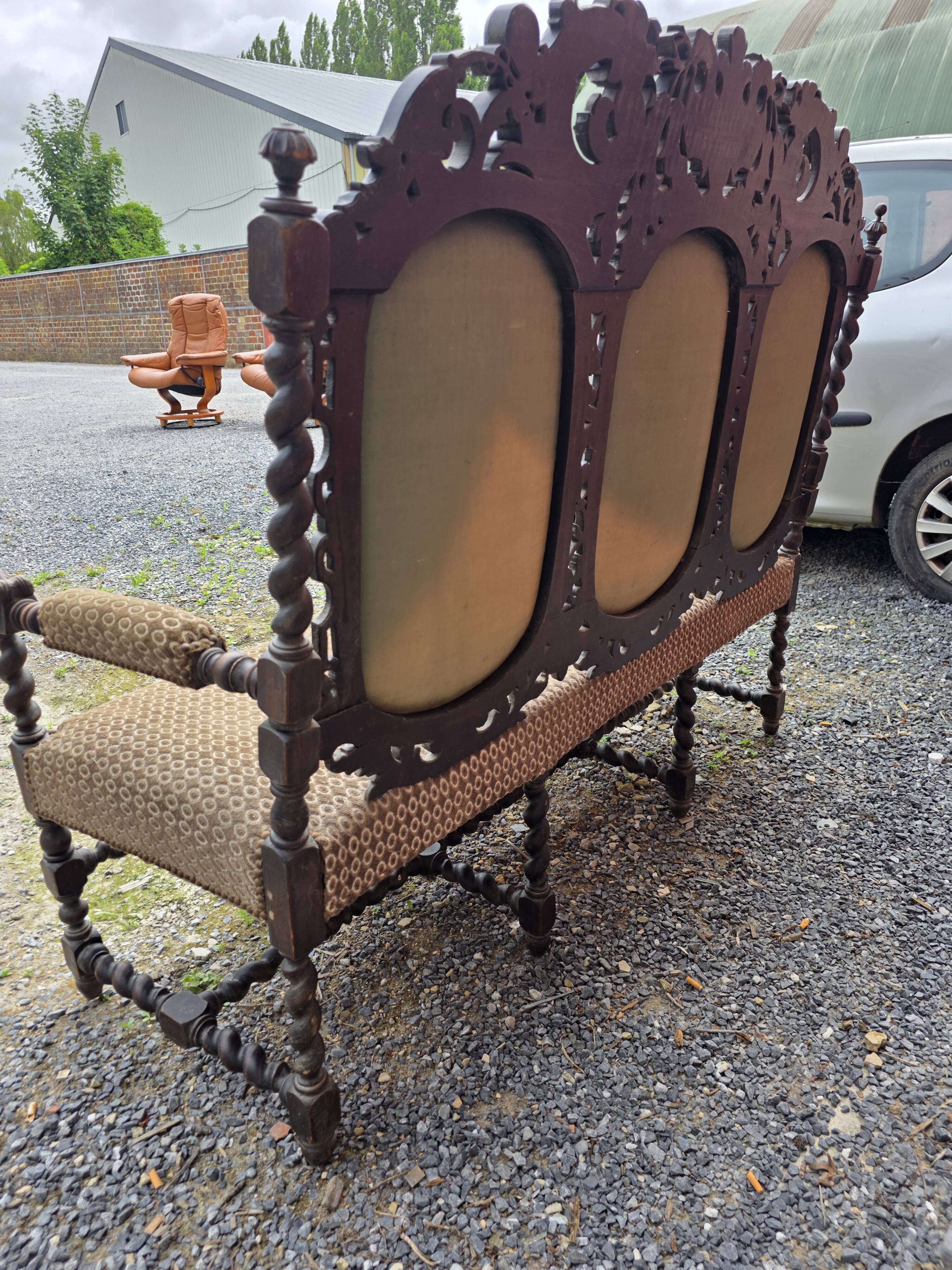 Three-seater armchair in Louis XIII style made of oak from the 19th century.