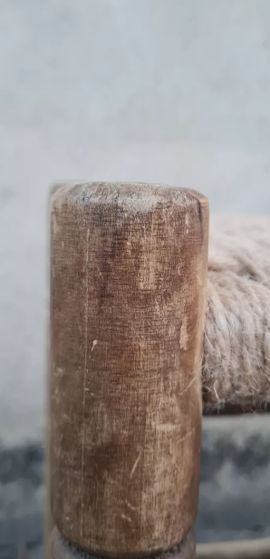 Vintage handmade wooden stool and rope