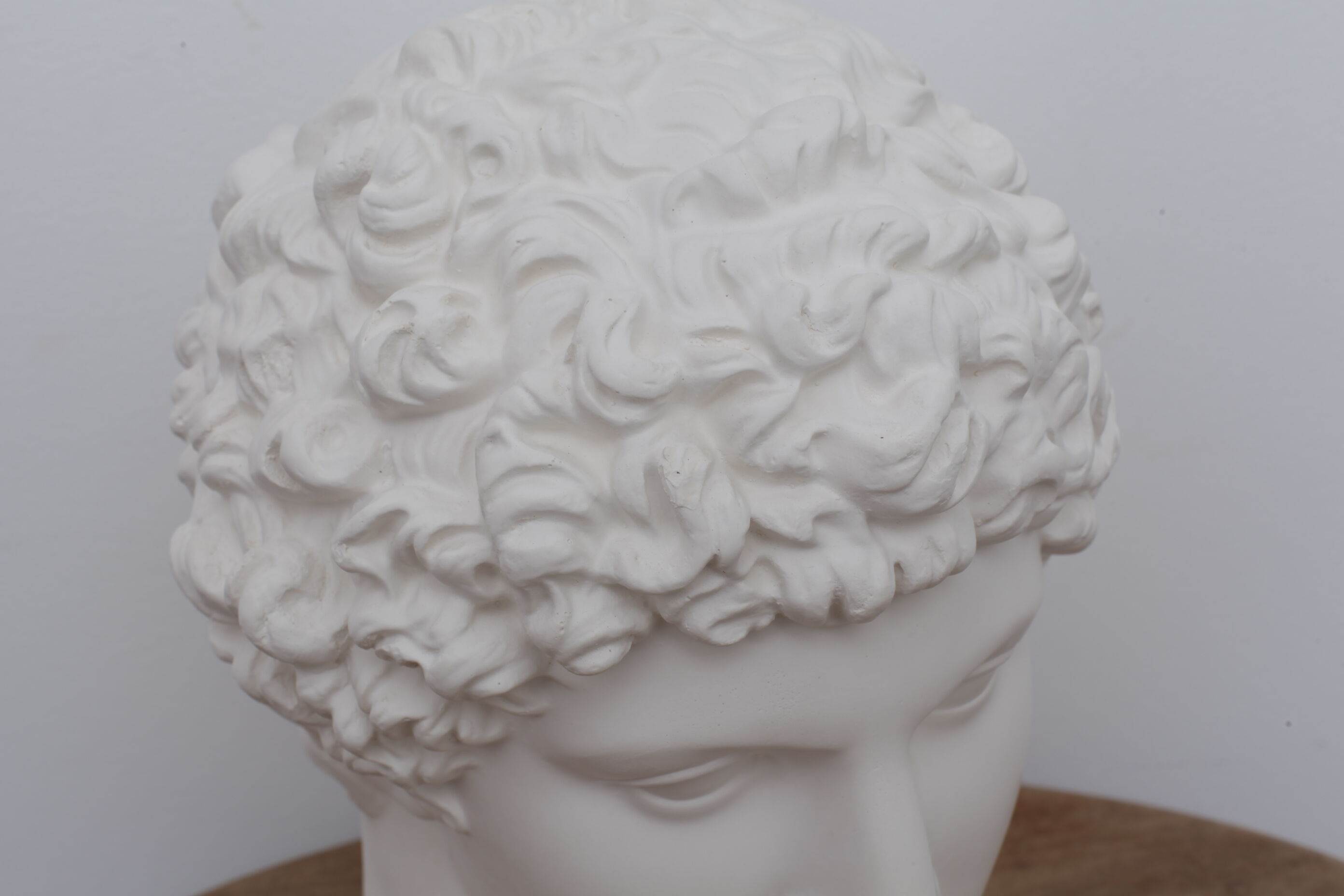 Greek head in matt white plaster