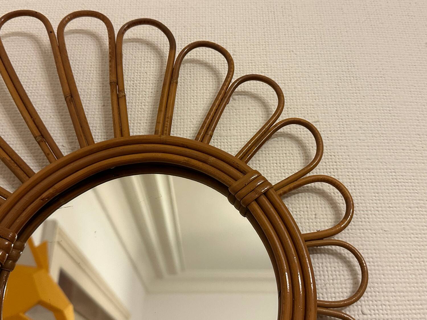 Old vintage asymmetrical round rattan mirror