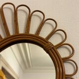 Old vintage asymmetrical round rattan mirror