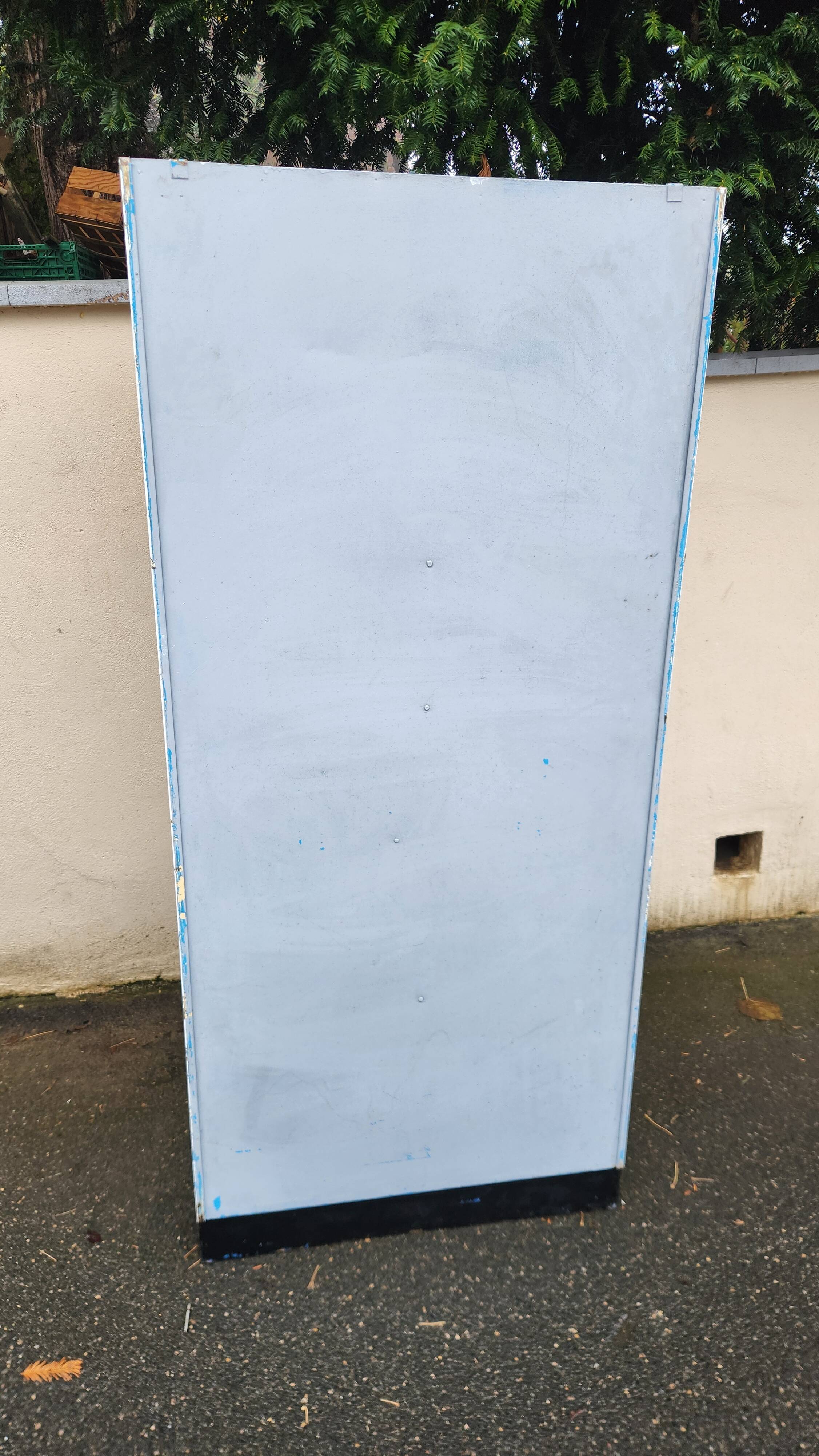 Old industrial metal cabinet in white and blue.