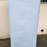 Old industrial metal cabinet in white and blue.