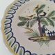 Antique hand-painted earthenware plate – piper and birds