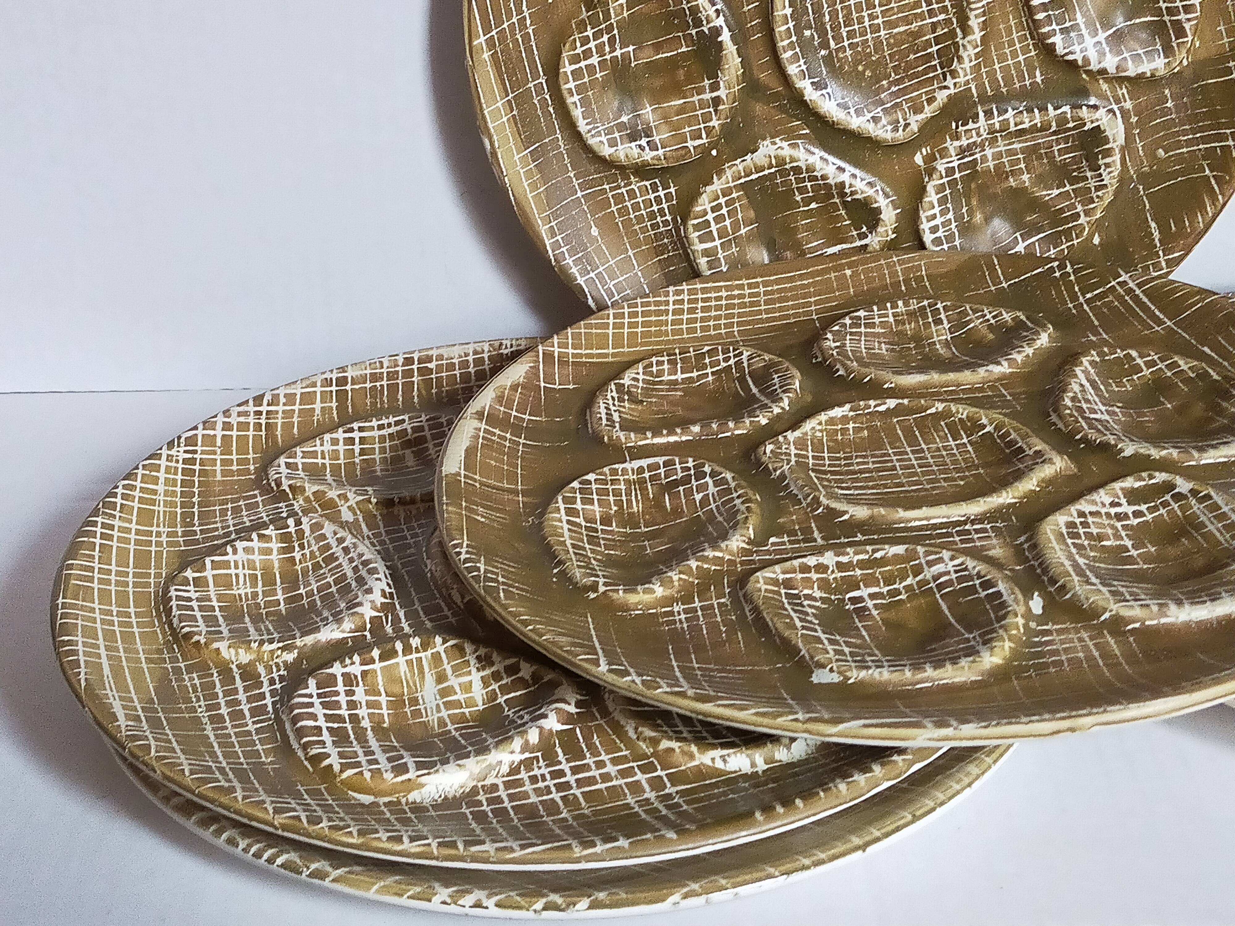 Six oyster plates earthenware with matte enamel, 50s