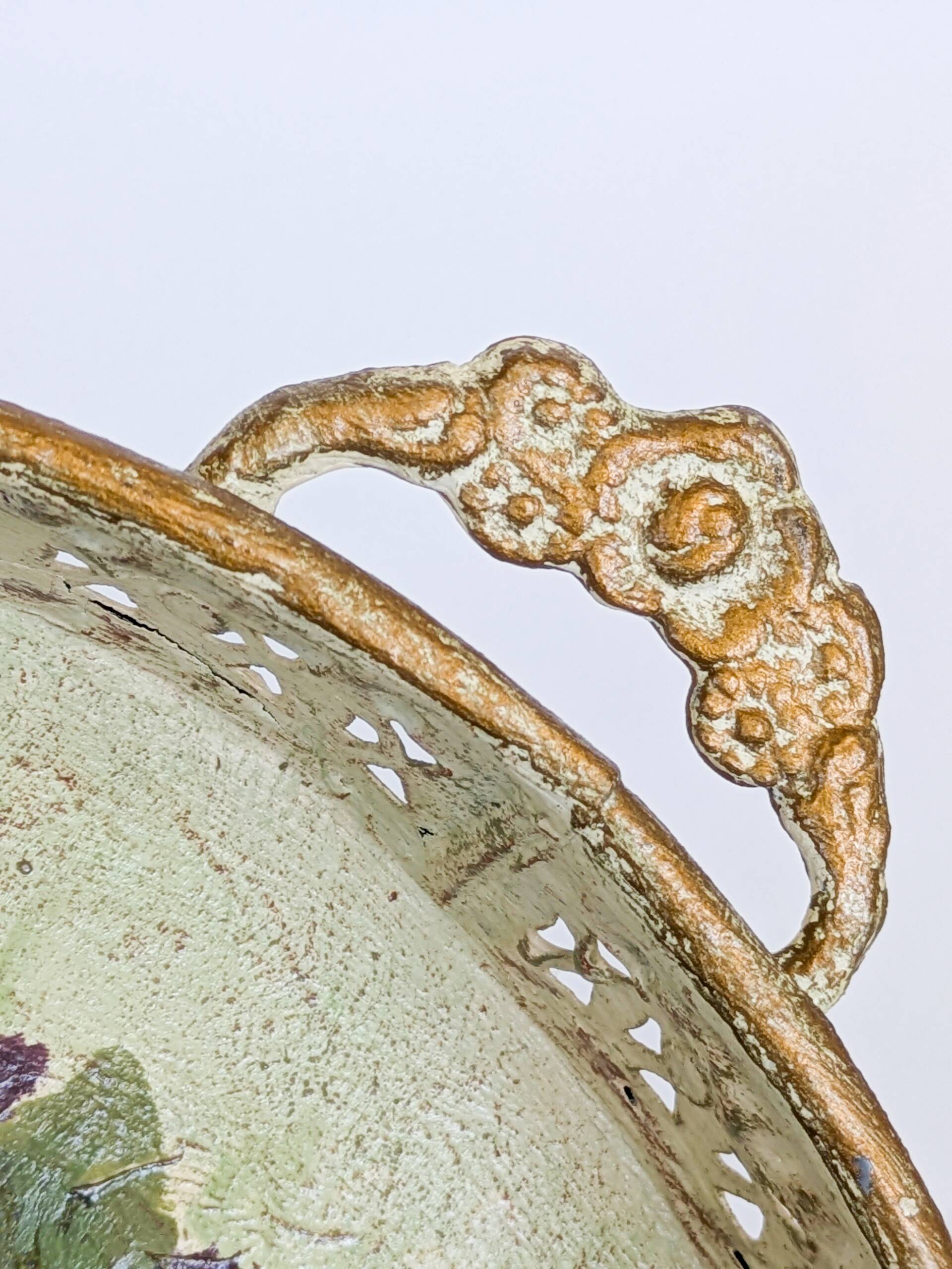 Oval metal decorative vintage tray with floral pattern.