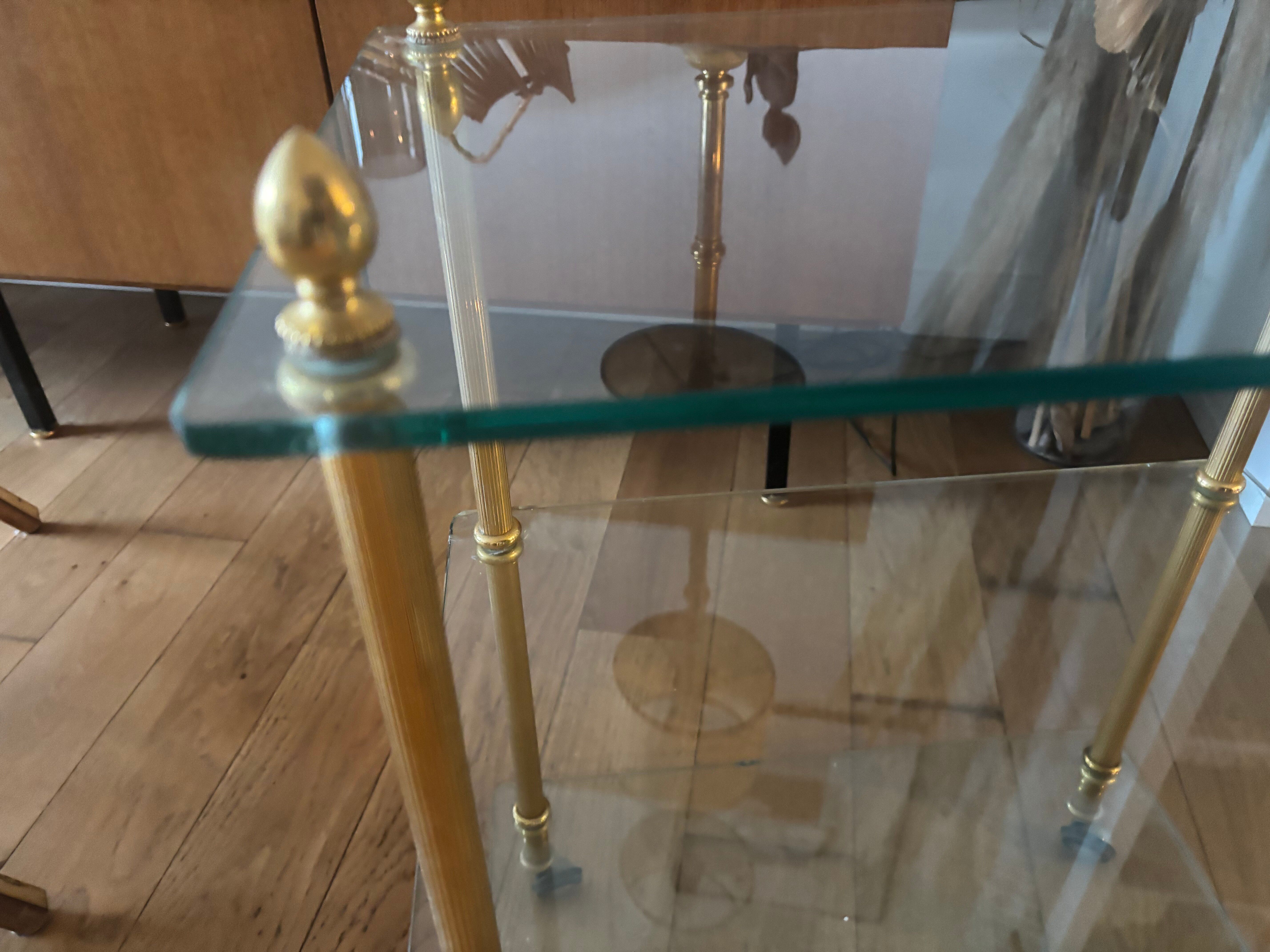 Elegant wheeled serving trolley in gilded brass and glass, in a spirit