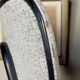 Chaise skaï moucheté et pieds tubes de métal noirs années 50