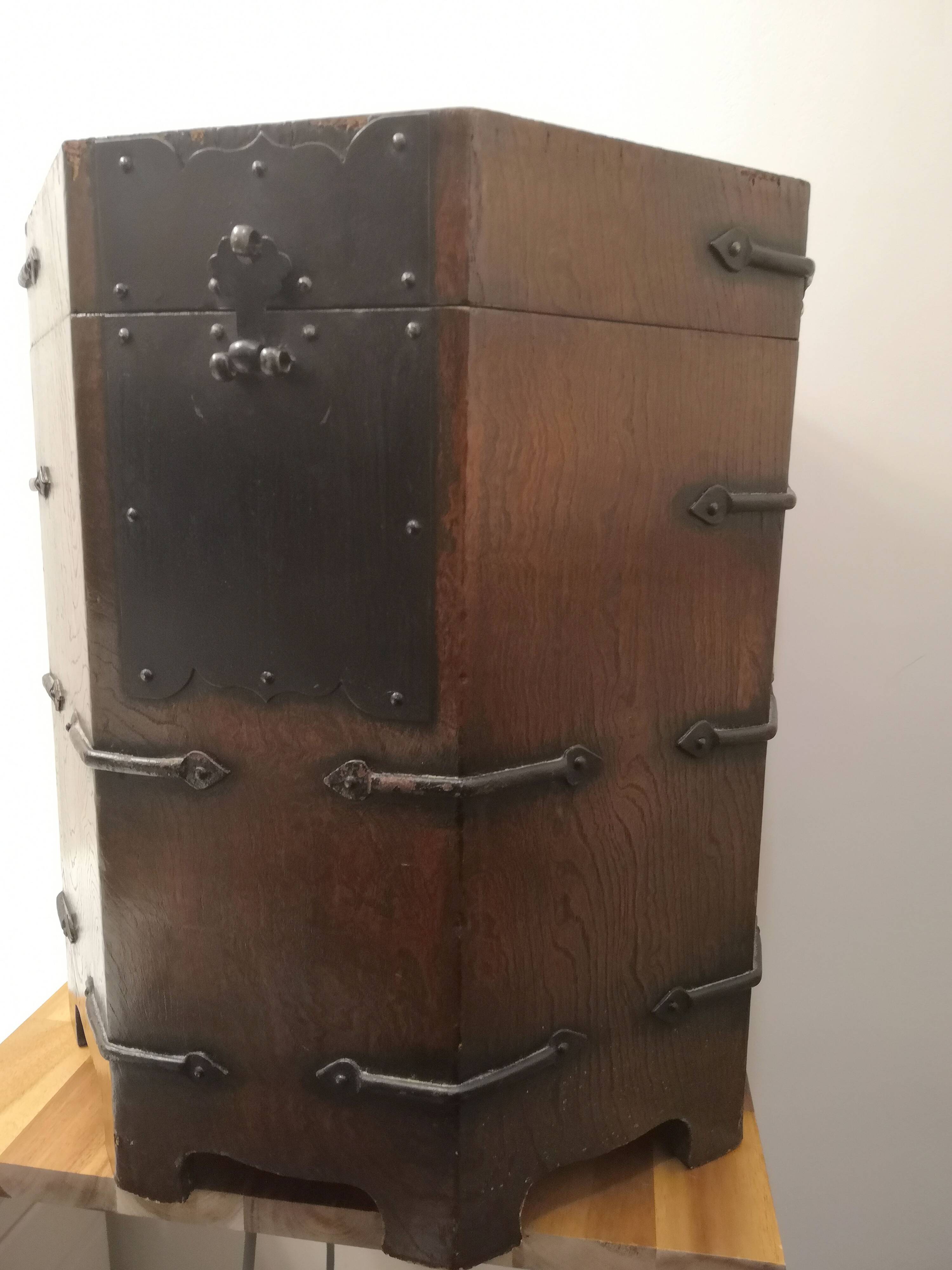 Octagonal wooden chest with metal ornaments from Asia